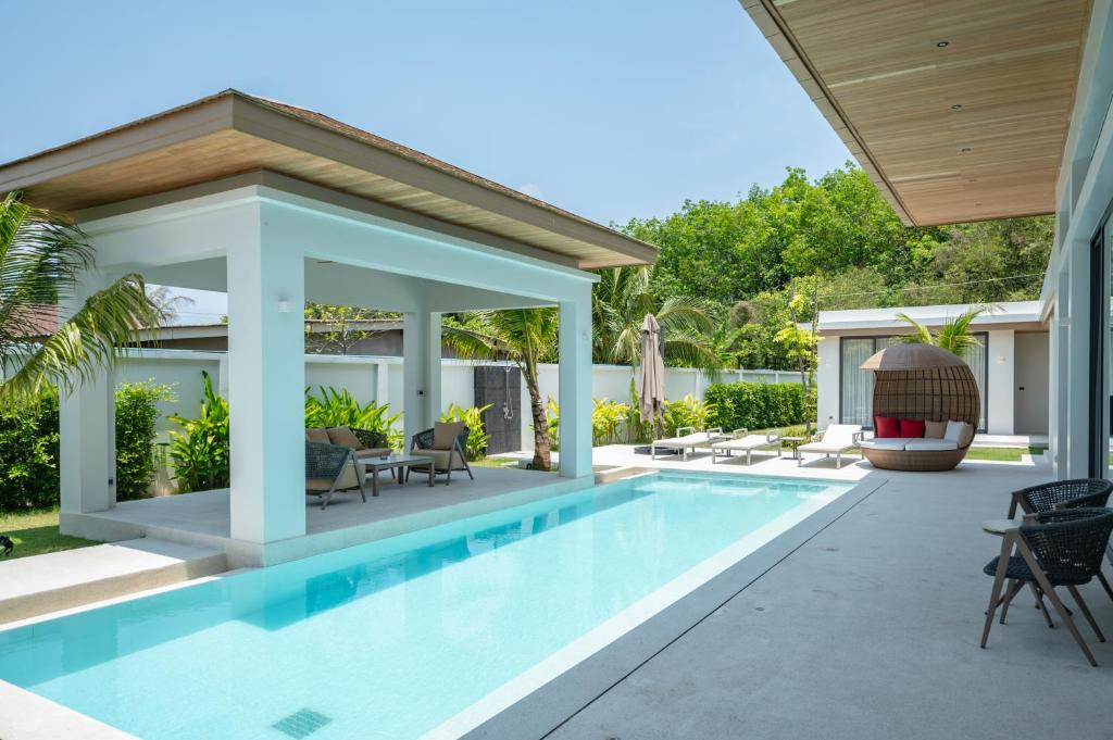 an image of a swimming pool in a house at Mouana Breeze Mai Khao VIP 4-bedroom Pool Villa 9913 in Mai Khao Beach