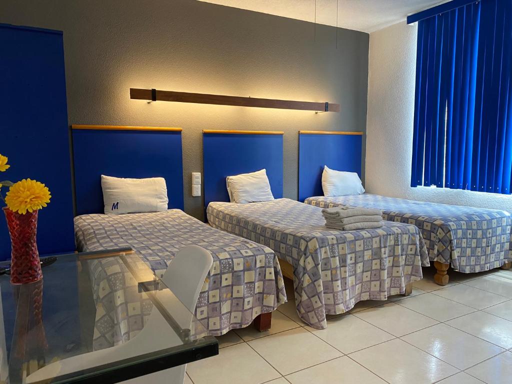 Postel nebo postele na pokoji v ubytování Hotel H Americas