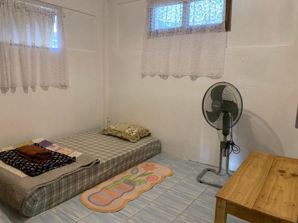 Postel nebo postele na pokoji v ubytování Ka Prao Kai Hostel