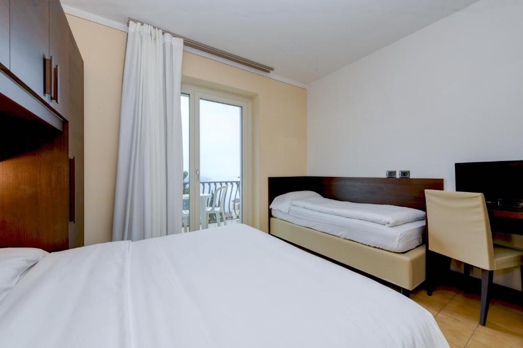 Postel nebo postele na pokoji v ubytování Hotel Bellavista