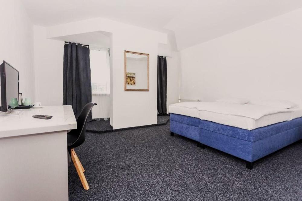 Postel nebo postele na pokoji v ubytování Hotel Joker