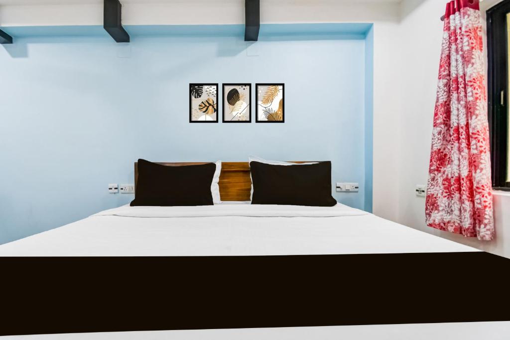 Postel nebo postele na pokoji v ubytování Hotel O KK A1 Guest House