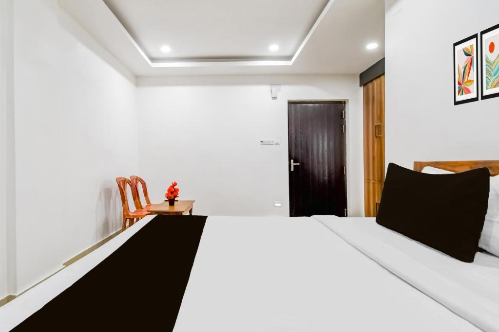 Postel nebo postele na pokoji v ubytování Hotel O KK A1 Guest House