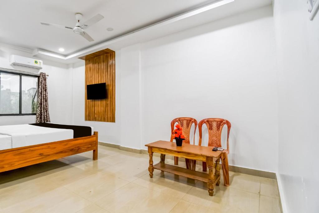 Postel nebo postele na pokoji v ubytování Hotel O KK A1 Guest House