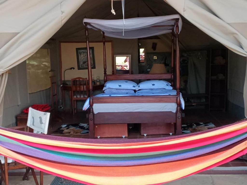Postel nebo postele na pokoji v ubytování Buffalo's Rest Greenpark-Naivasha