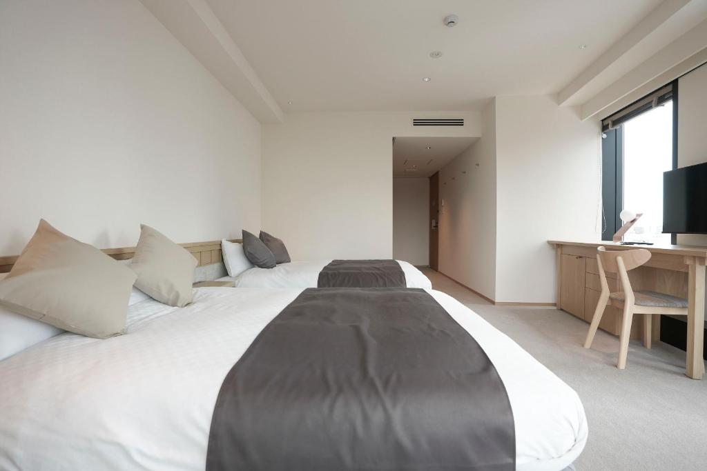 Postel nebo postele na pokoji v ubytování Hotel S-Presso South II