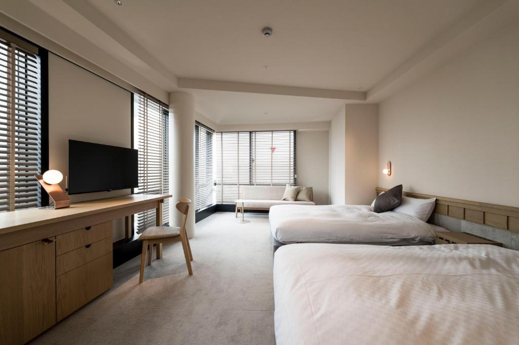 Postel nebo postele na pokoji v ubytování Hotel S-Presso South II
