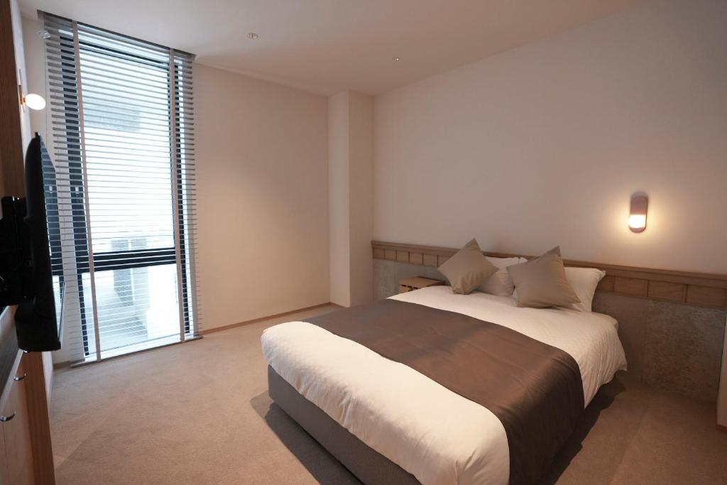 Postel nebo postele na pokoji v ubytování Hotel S-Presso South II