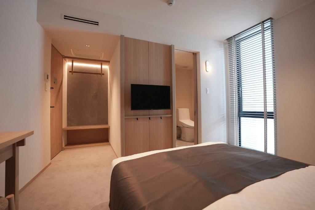 Postel nebo postele na pokoji v ubytování Hotel S-Presso South II