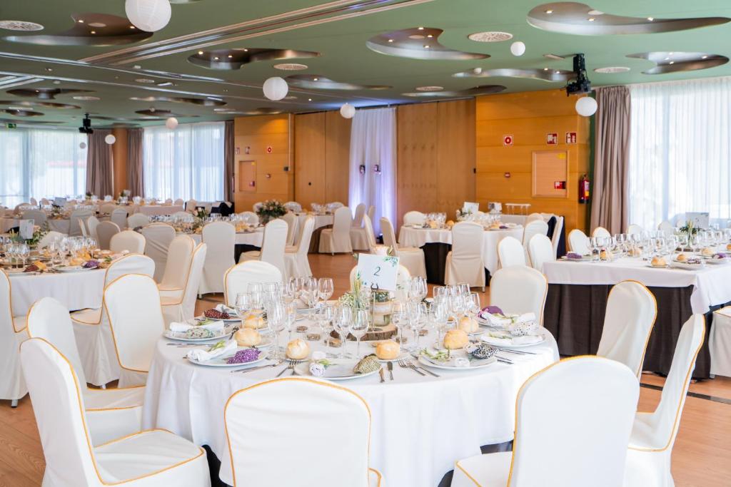a set up for a banquet with white tables and chairs at Abba Huesca in Huesca