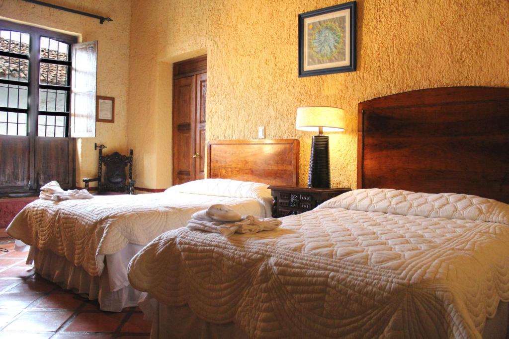 Postel nebo postele na pokoji v ubytování Hotel Casona de Manzano