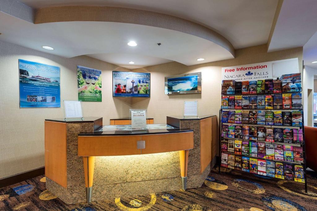 a store lobby with a desk in a store at Howard Johnson Plaza by Wyndham by the Falls Niagara Falls in Niagara Falls