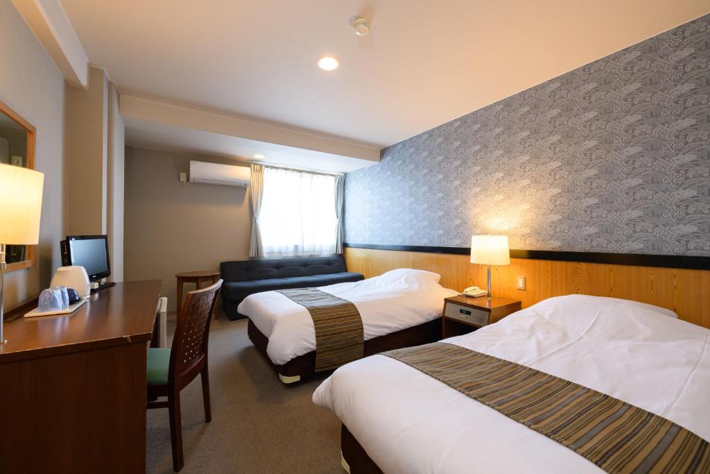 Postel nebo postele na pokoji v ubytování Hotel Asyl Nara Annex