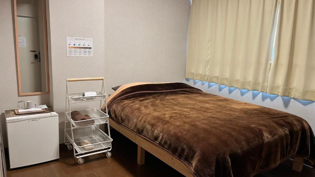 Postel nebo postele na pokoji v ubytování Easy Stay Chichibu