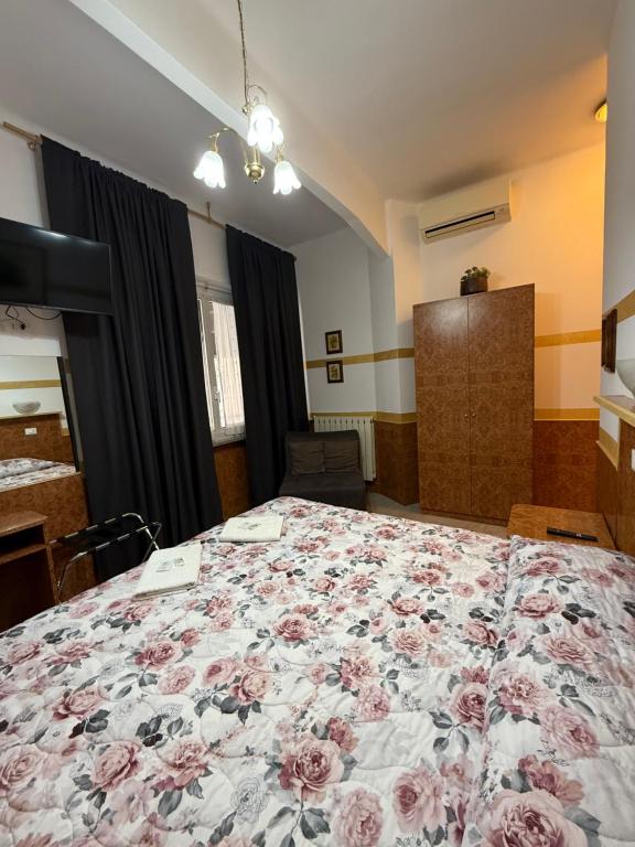 Postel nebo postele na pokoji v ubytování hotel fiumara