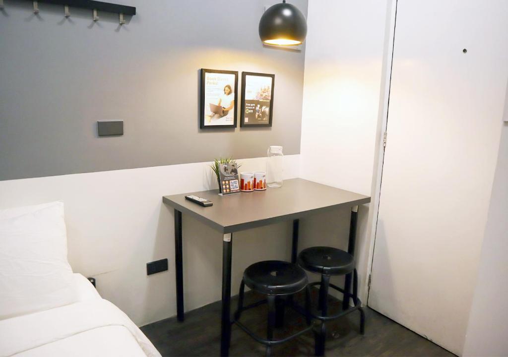 Postel nebo postele na pokoji v ubytování mySTAY Hotel BGC West