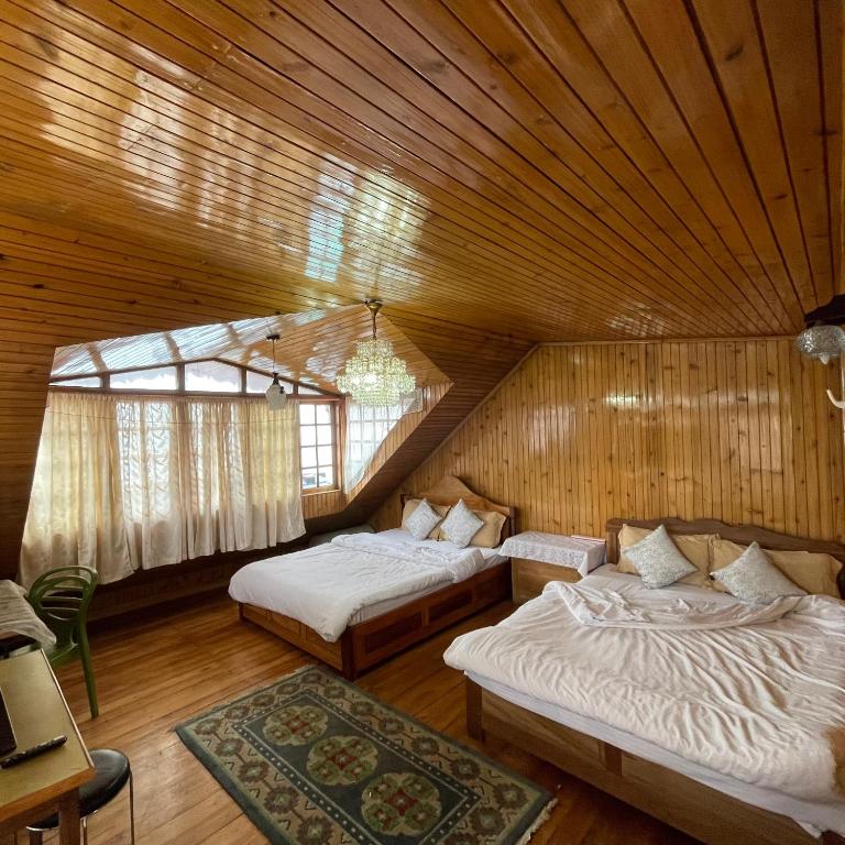 Postel nebo postele na pokoji v ubytování Ngawang homestay