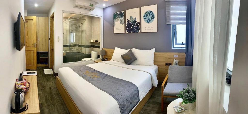 Postel nebo postele na pokoji v ubytování Dang's Hotel
