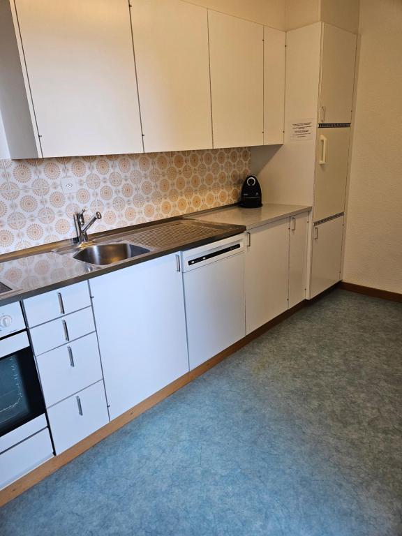 Kuchyň nebo kuchyňský kout v ubytování Ferienwohnungen Chesa Clois 24