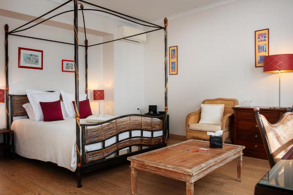 Postel nebo postele na pokoji v ubytování L'Aubinière Hôtel Restaurant & Spa