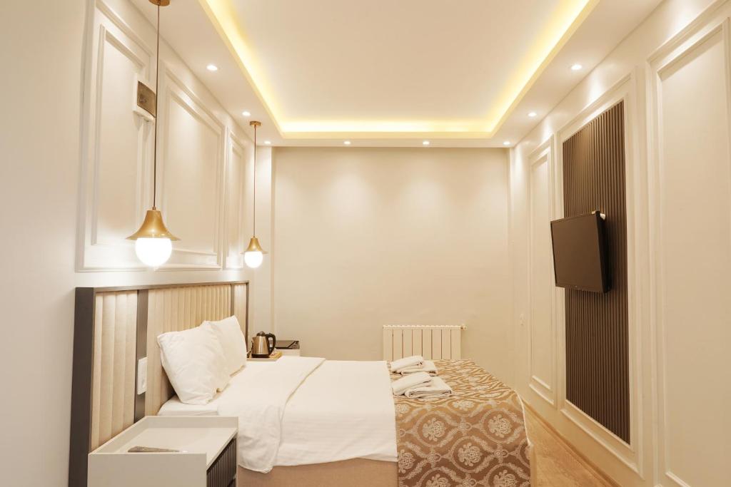 Postel nebo postele na pokoji v ubytování Ararat Hotel