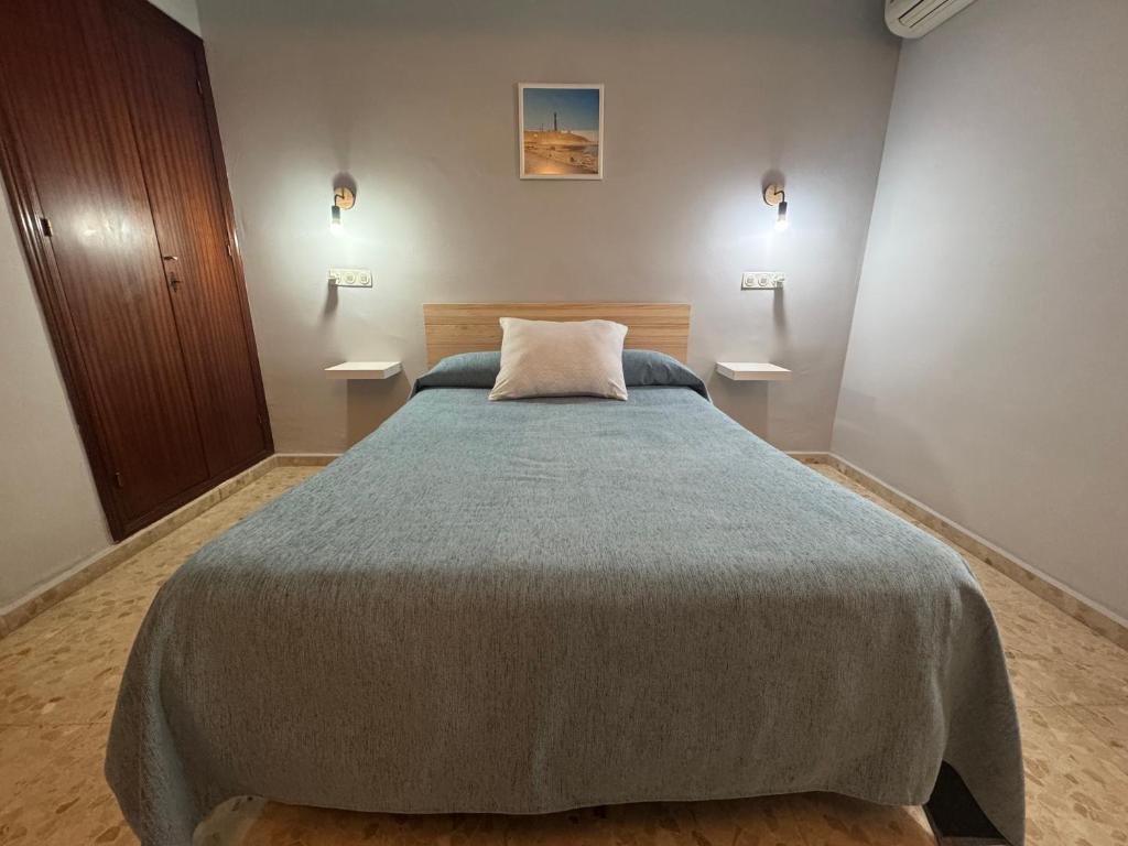 Postel nebo postele na pokoji v ubytování Hostal Miramar