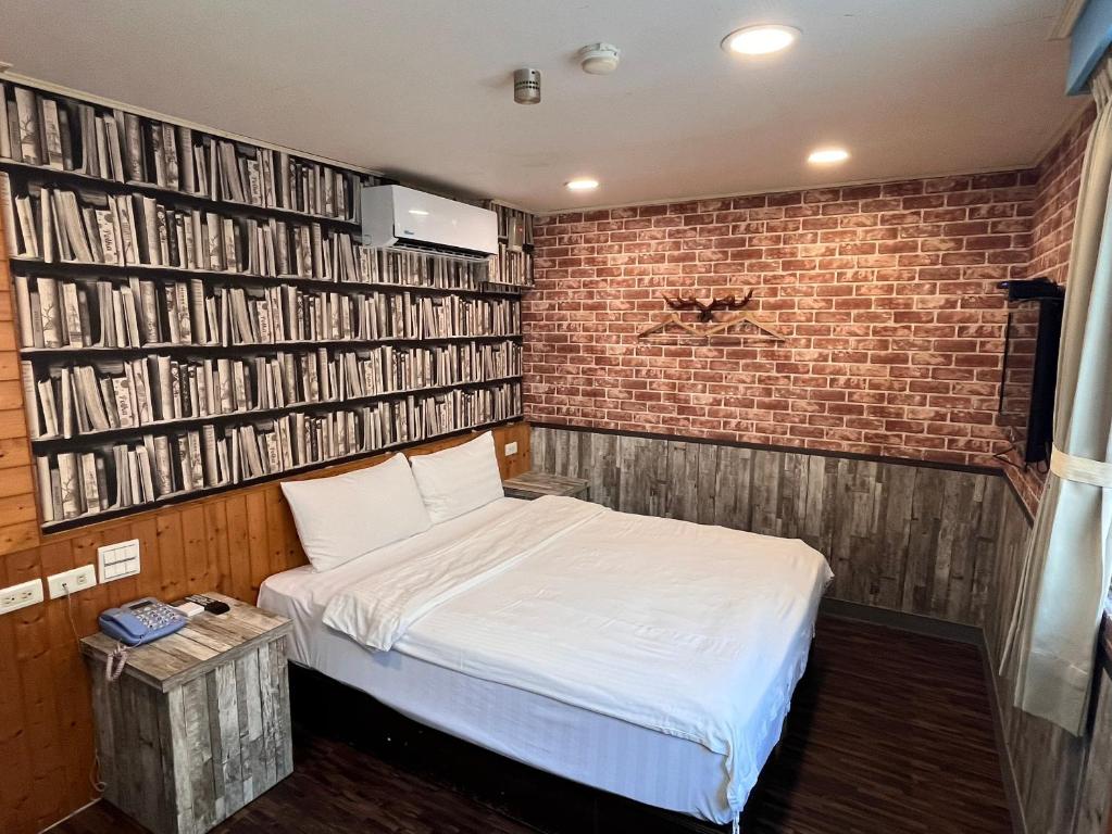 Postel nebo postele na pokoji v ubytování Bin Chen Business Hotel