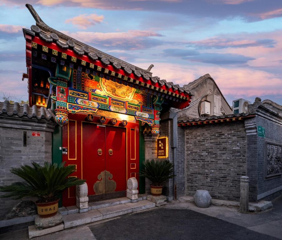 a building with a red door with akritkritkrit at Liuli Tile Courtyard Hotel Tian Anmen Wangfujing Houhai in Beijing