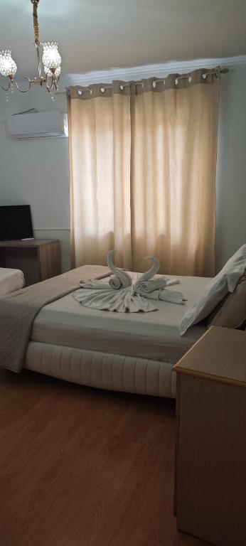 Postel nebo postele na pokoji v ubytování Center Elite