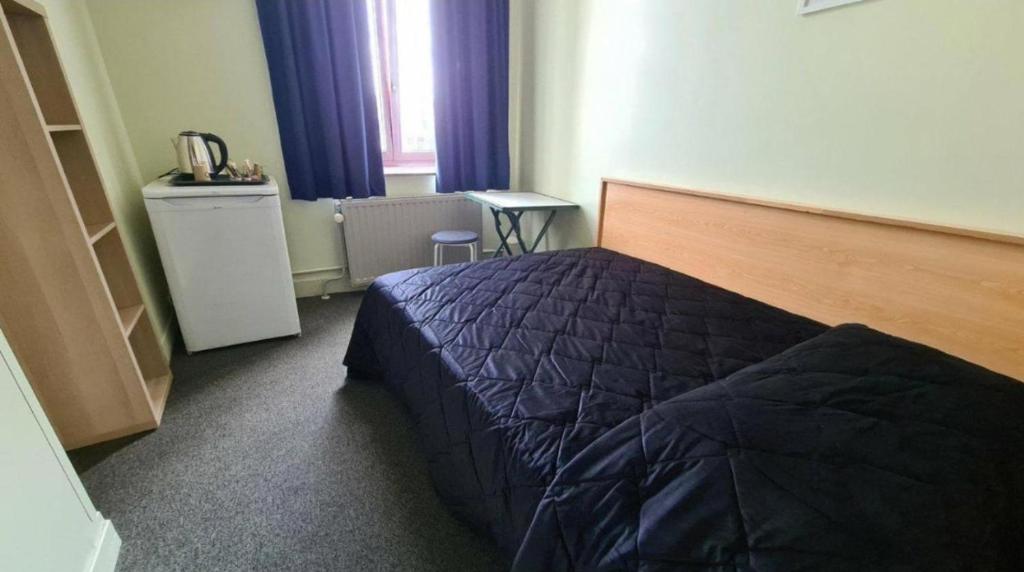 Postel nebo postele na pokoji v ubytování Center Elite