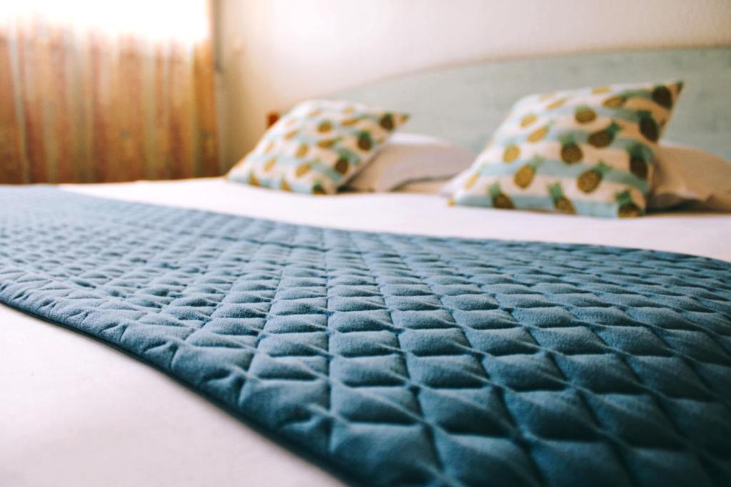 Postel nebo postele na pokoji v ubytování Hotel Poretta