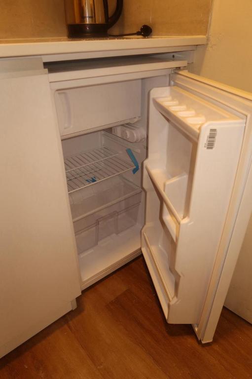 an empty refrigerator with its door open in a kitchen at Bella Vista House in Eilat