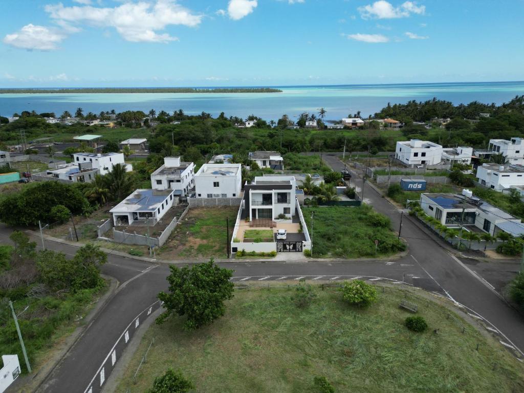 an aerial view of a neighborhood with houses and the ocean at LuxNar FF Sea in La Gaulette