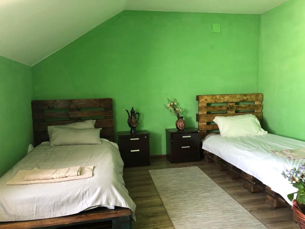 Postel nebo postele na pokoji v ubytování Secret Garden