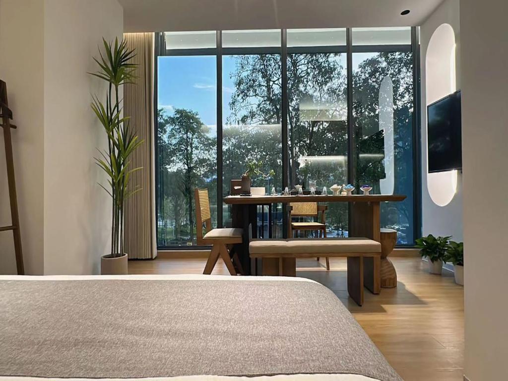 Ένα ή περισσότερα κρεβάτια σε δωμάτιο στο Ming Shanshui Retreat