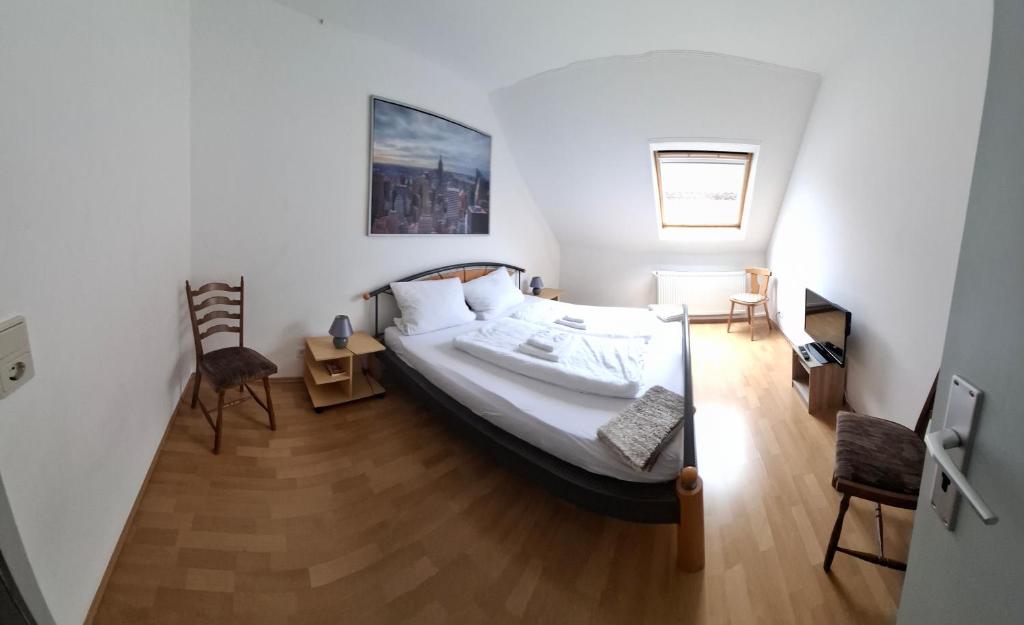 Postel nebo postele na pokoji v ubytování Gästezimmer / Weingut Peter