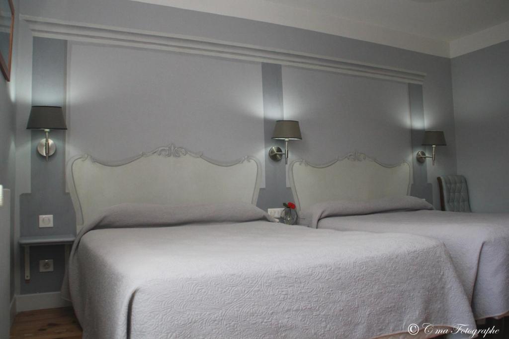 Postel nebo postele na pokoji v ubytování Hôtel Majestic
