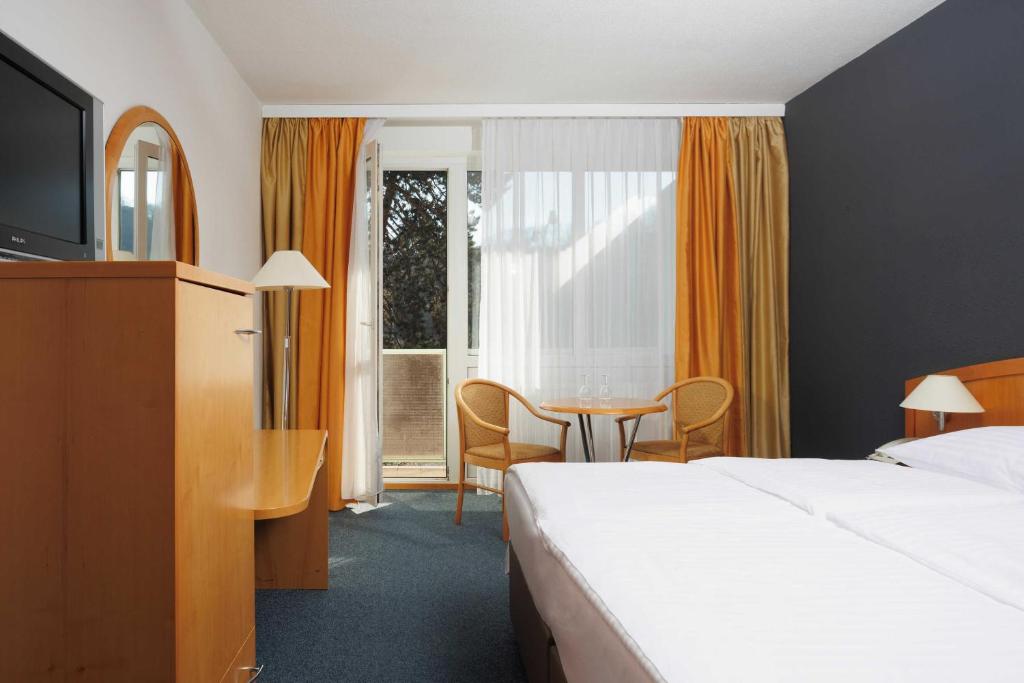 Postel nebo postele na pokoji v ubytování OREA Hotel Voro Brno