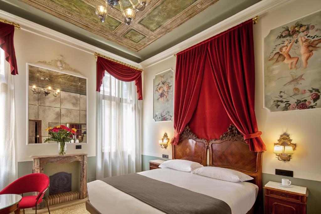 Postel nebo postele na pokoji v ubytování UNAHOTELS Ala Venezia-Adults 16