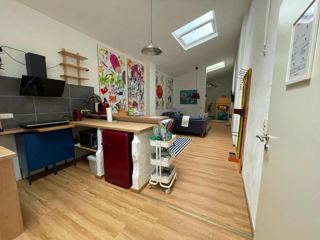 a room with a kitchen with a counter top at MiNe Hotel in Weilerswist