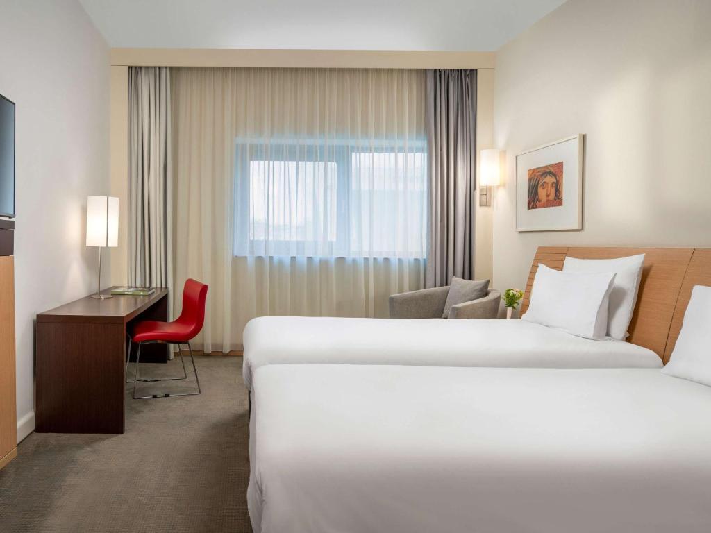 Cama ou camas em um quarto em Novotel Gaziantep