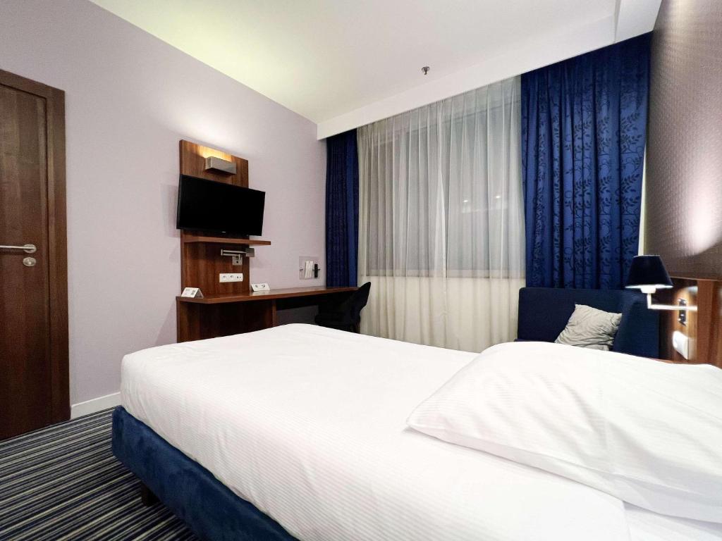 Postel nebo postele na pokoji v ubytování ibis Styles Wałbrzych