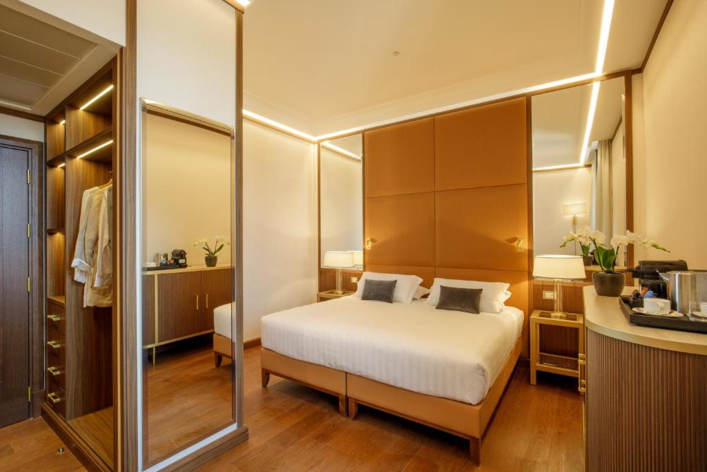 Postel nebo postele na pokoji v ubytování Hotel Imperiale by OMNIA hotels