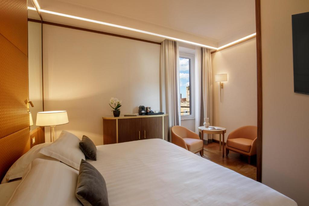 Postel nebo postele na pokoji v ubytování Hotel Imperiale by OMNIA hotels