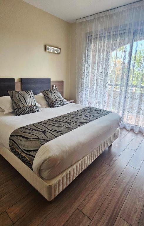 Postel nebo postele na pokoji v ubytování Hotel Poretta