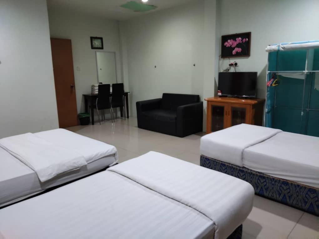 Letto o letti in una camera di T Lodge, Kapit