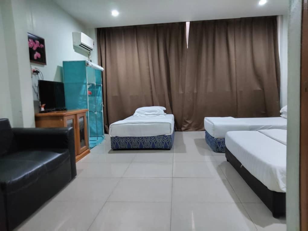 Letto o letti in una camera di T Lodge, Kapit