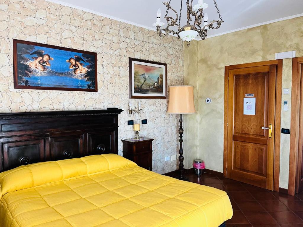 Postel nebo postele na pokoji v ubytování La Mammola Bed&Breakfast