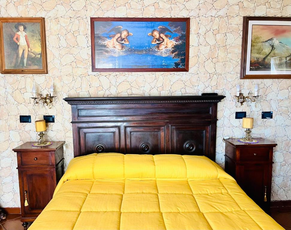 Postel nebo postele na pokoji v ubytování La Mammola Bed&Breakfast