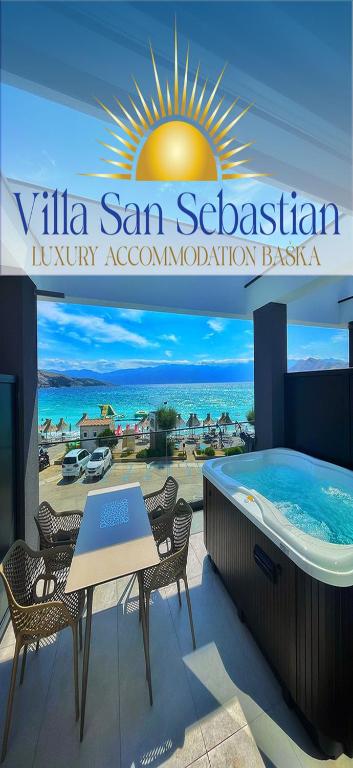 a sign for a resort with a hot tub at Villa San Sebastian-Baška in Baška